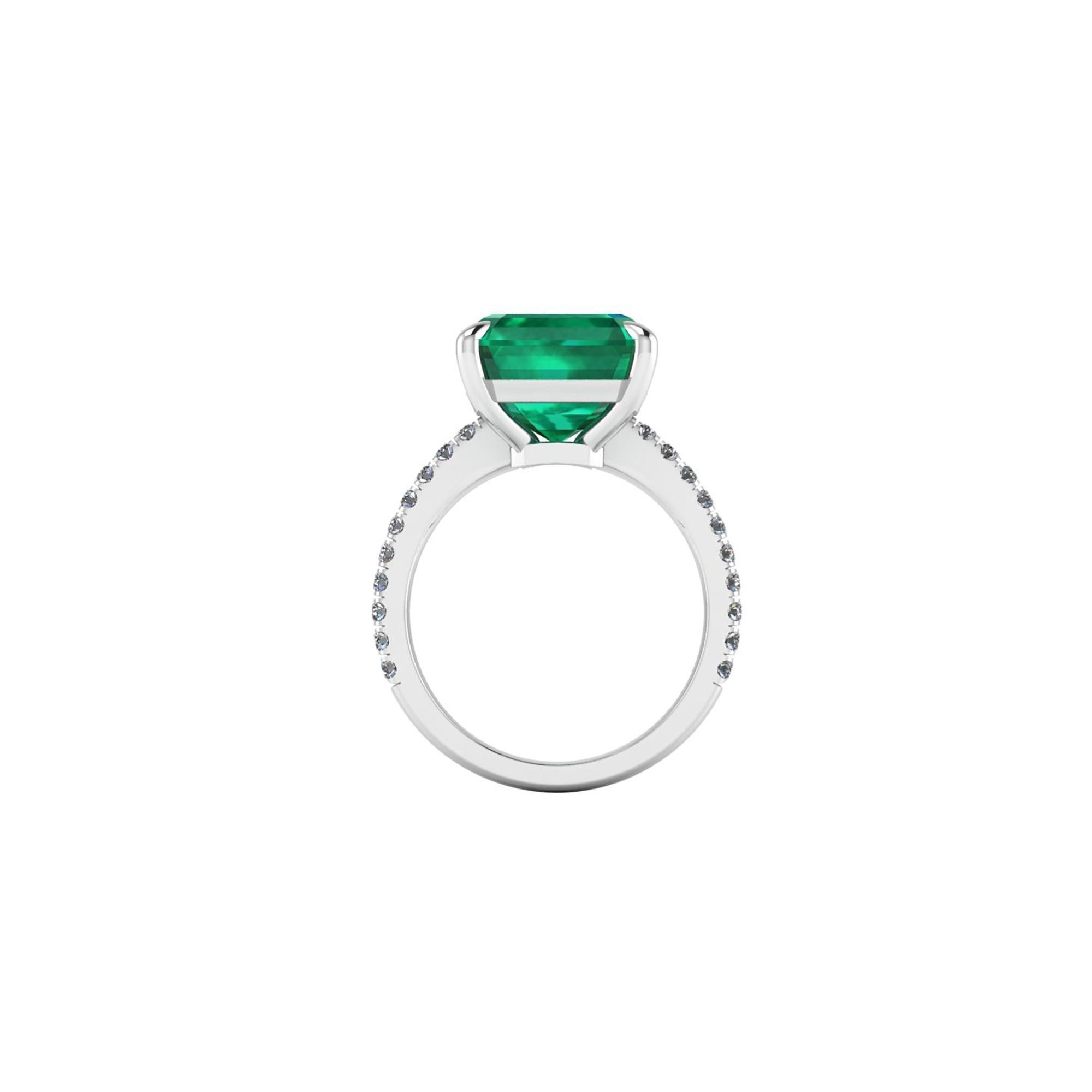 GRS Certified 6.95 carat Colombian emerald cut Emerald, very high quality color,  embellished by a pave' of bright diamonds of approximately  total carat weight of 0.32 carat, set in a hand crafted Platinum 950 ring, manufactured with the best
