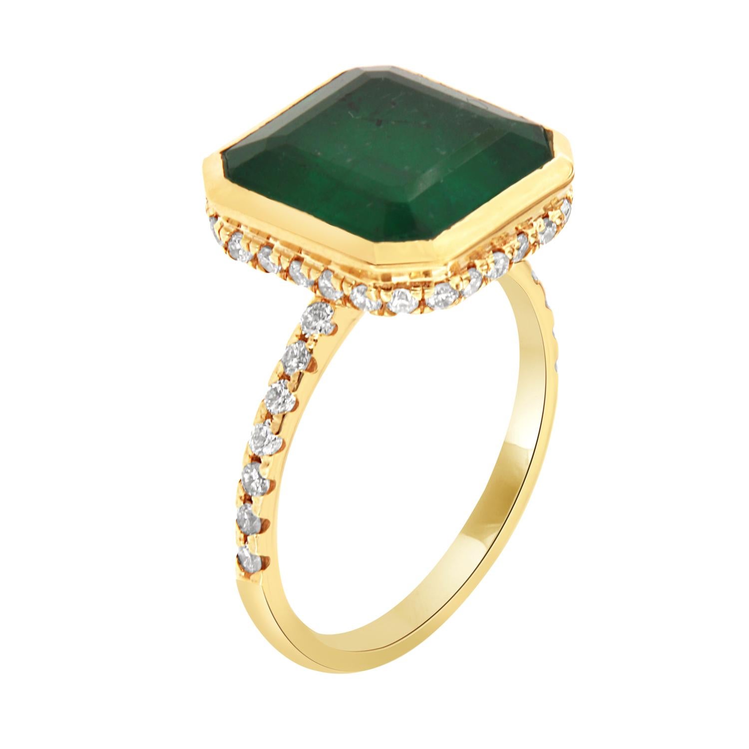This beautiful ring features a GIA-certified 6.98 Carat Asscher-shaped Green Emerald bezel set.  A hidden halo of brilliant round diamonds encircled the crown. A delicate row of diamonds is a Micro-Prong set on top of a 1.8 mm wide band. 
The