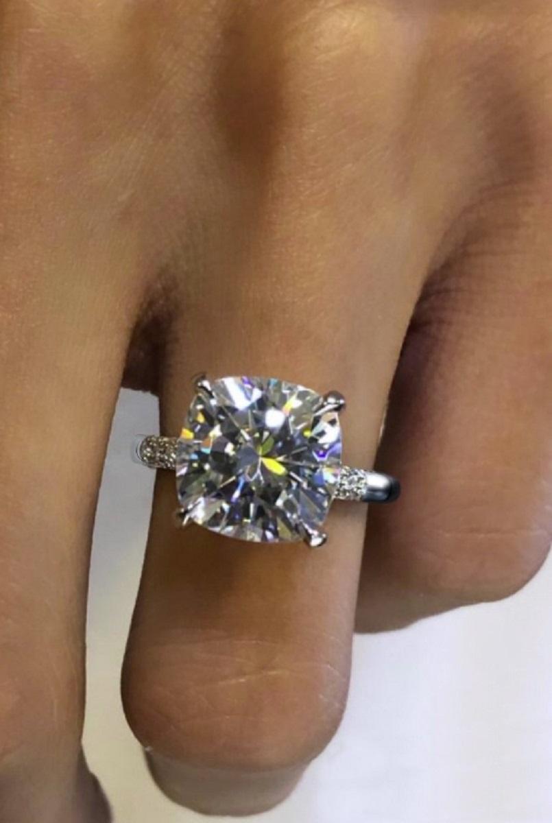An exquisite GIA certified 5 carat cushion modified brilliant cut diamond with a gorgeous pave of round brilliant cut diamonds

The main stone is absolutely crisp having very good polish and very good symmetry, is graded F in color and VS in