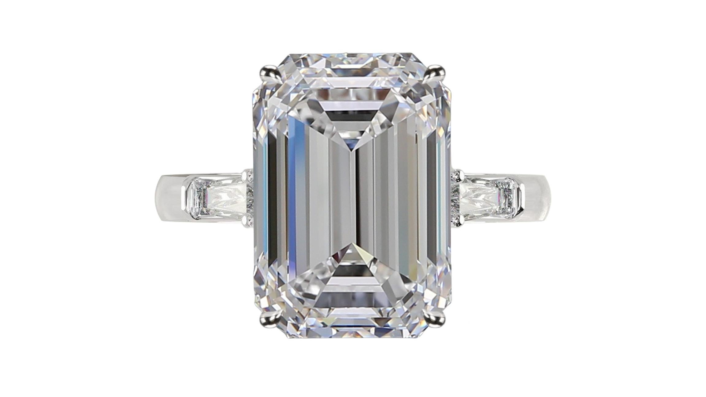 Amazing emerald cut diamond ring the main stone is an exquisite 6 carat emerald cut diamond with G color and VVS1 clarity plus excellent polish and symmetry.

the side diamonds are tapered baguette and very pure 

mounted in solid platinum