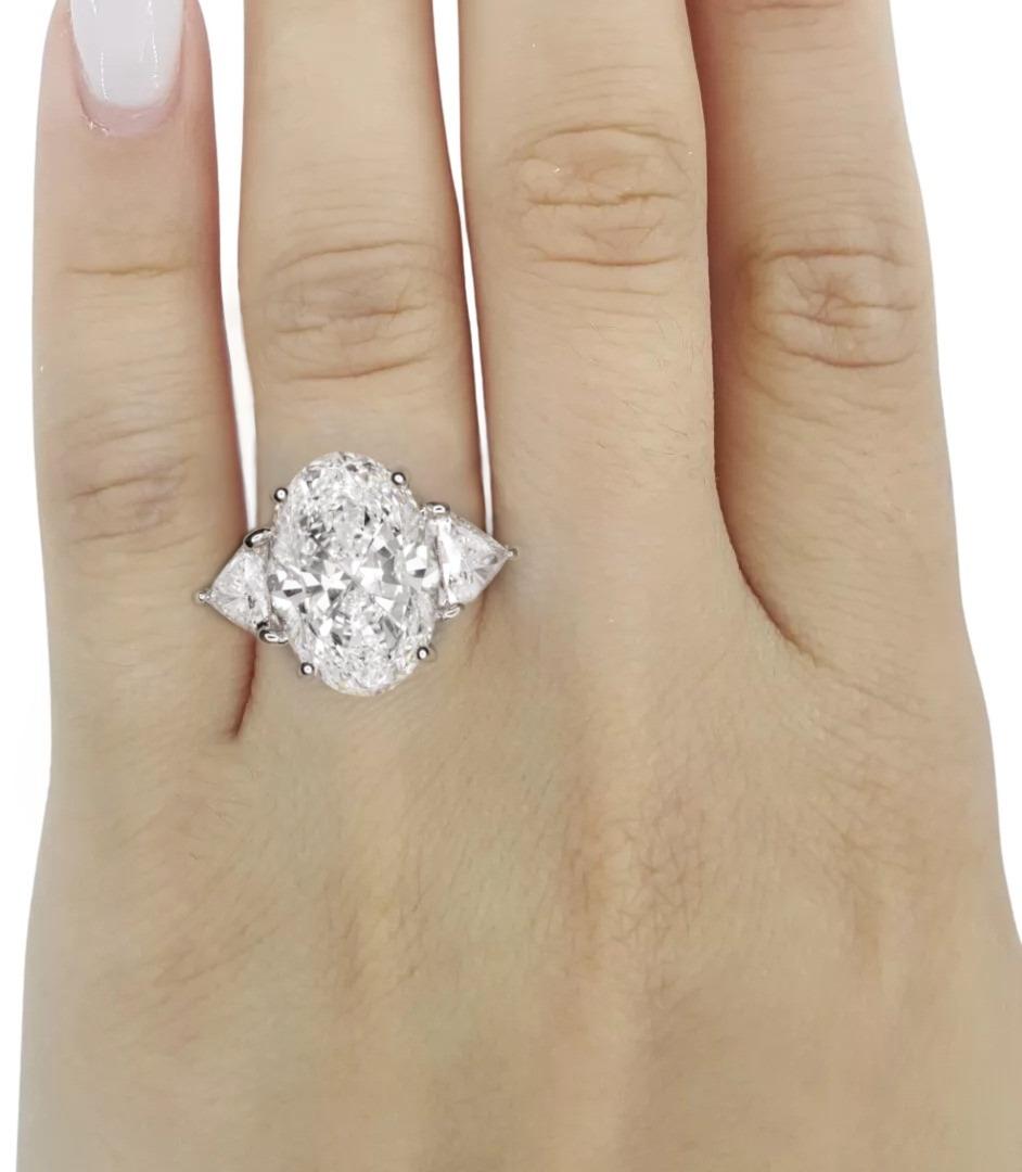 Stunning 7 carat oval diamond set in platinum
two side trillion cut diamonds
the ring can be resized if required
GIA certified and laser inscribed
