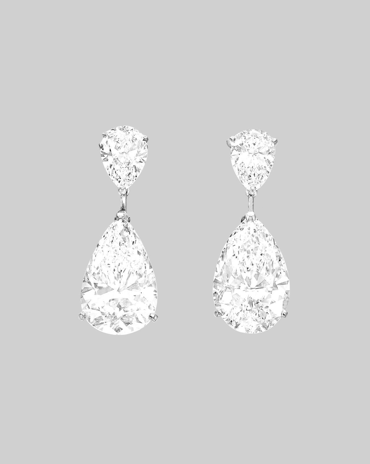 Modern GIA Certified 7 Carat Pear Cut Diamond Dangle Platinum Earrings For Sale