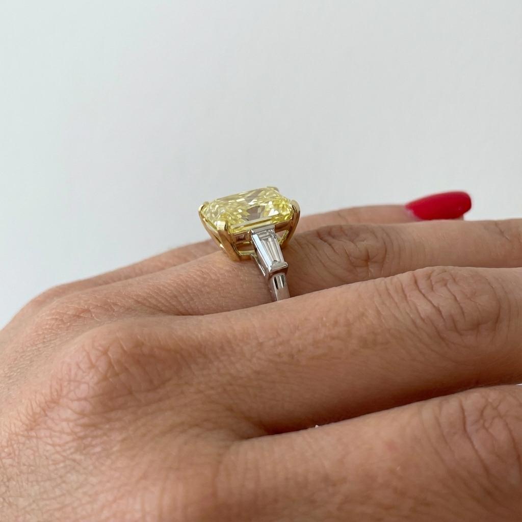 Contemporary GIA Certified 7 Carat Radiant Cut Fancy Yellow Diamond with tapered baguette For Sale