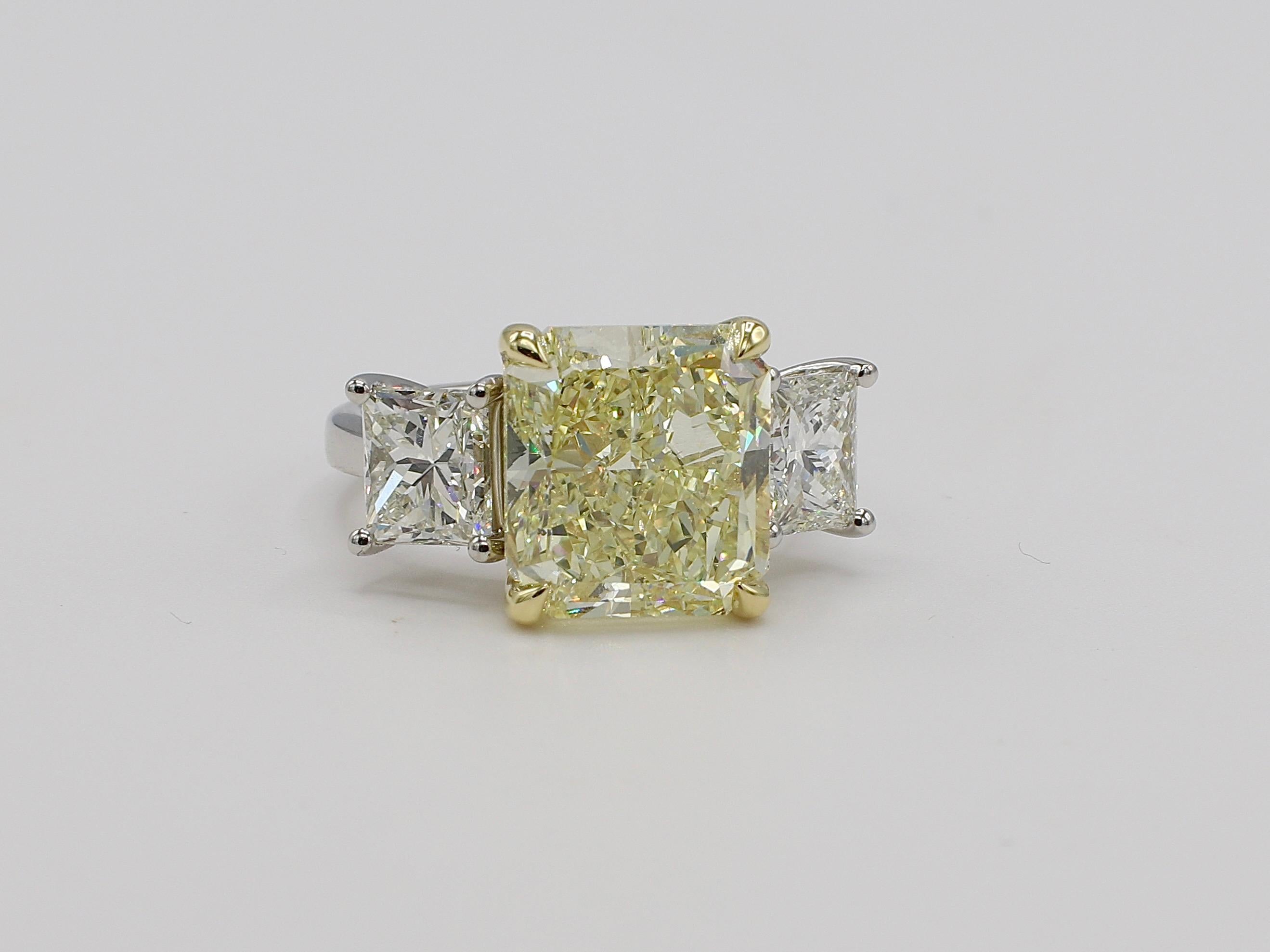 GIA Certified 7.01 Carat Radiant Light Yellow Y-Z Range VS2 Platinum Diamond 3 Stone Engagement Ring Size 6 
Center diamond: 
GIA Report Number: 2215348693 (please note report pictured for details)
Carat: 7.01
Shape: Cut Cornered Rectangular