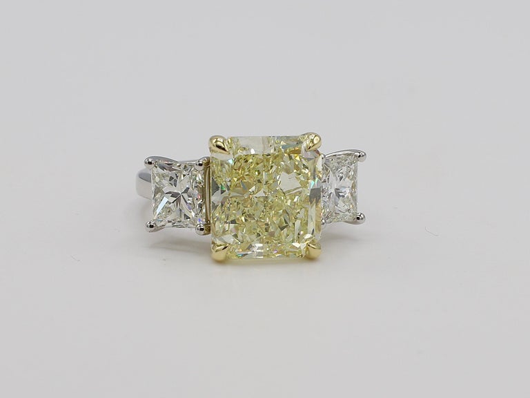 GIA Certified 7.01 Carat Radiant Light Yellow Y-Z Range VS2 Platinum Diamond 3 Stone Engagement Ring Size 6 
Center diamond: 
GIA Report Number: 2215348693 (please note report pictured for details)
Carat: 7.01
Shape: Cut Cornered Rectangular