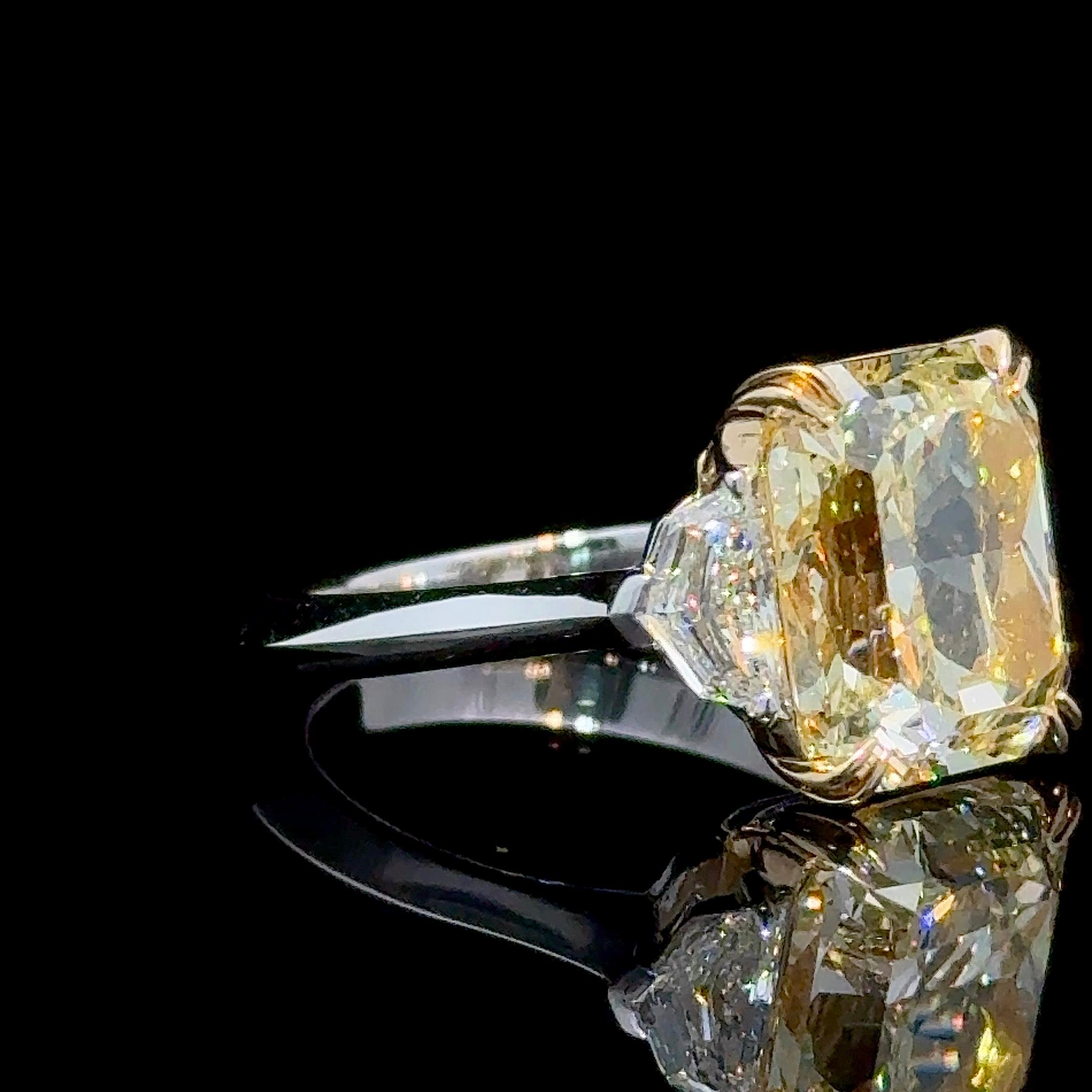 GIA Certified 7.01 Carat Rectangular Radiant Cut Yellow Diamond Three Stone Ring
Set in a our signature Three Stone Ring with twin 