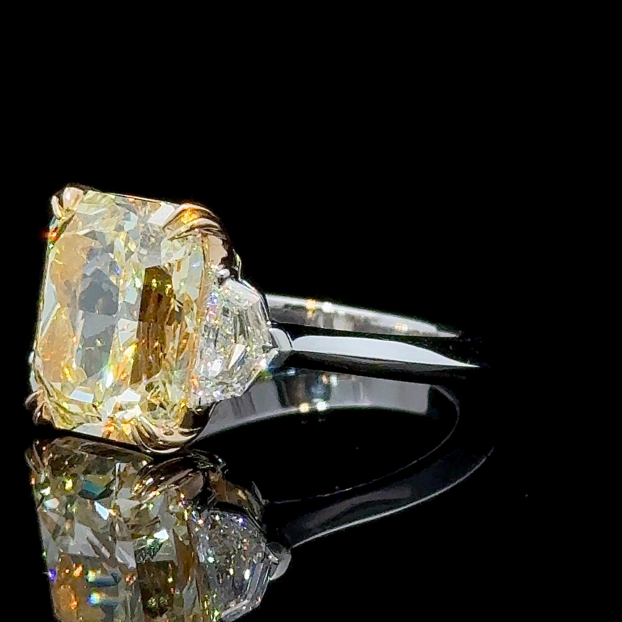 GIA Certified 7.01 Carat Radiant Cut Yellow Diamond Three Stone Ring In New Condition For Sale In New York, NY
