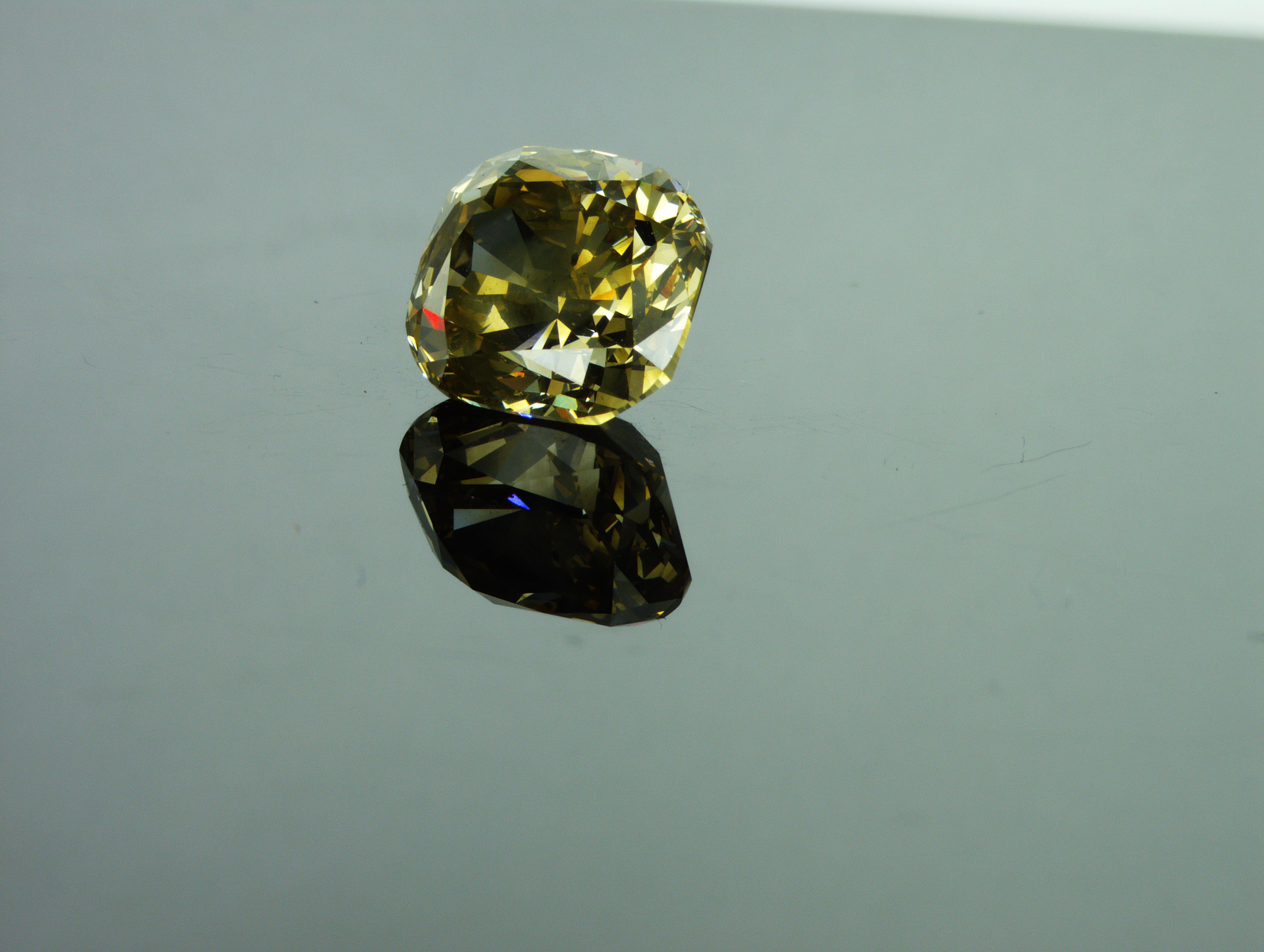 We are natural diamond production company located in Dubai.
Weight: 7.02ct
Shape: Cushion
Color: Brown-Yellow
Intensity: Fancy
Clarity: I1
Polish: Excellent
Symm: Good