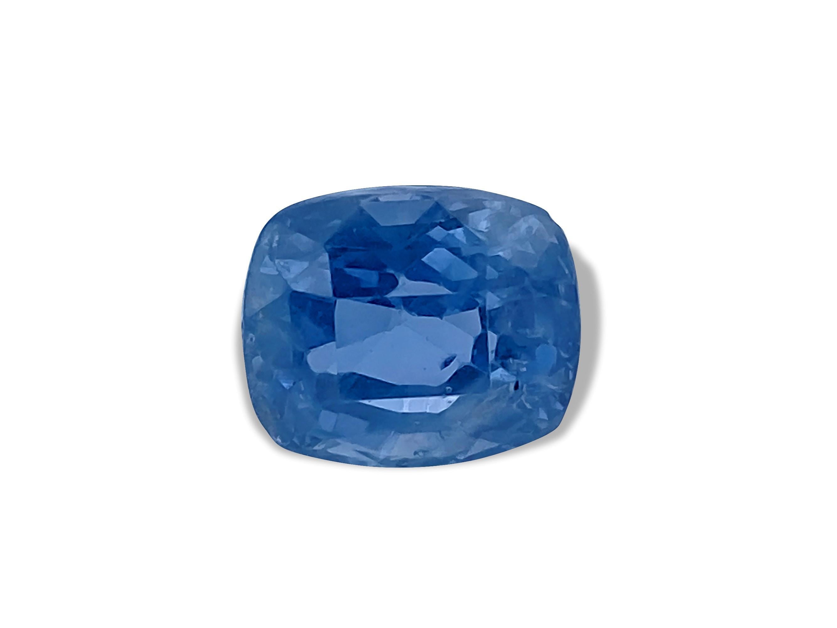 This magnificent blue sapphire, weighing 7.02 carats, is a true natural wonder, untouched by heat treatment, and sourced directly from the earth. Its captivating cushion cut showcases its remarkable beauty, making it a standout piece on its own.