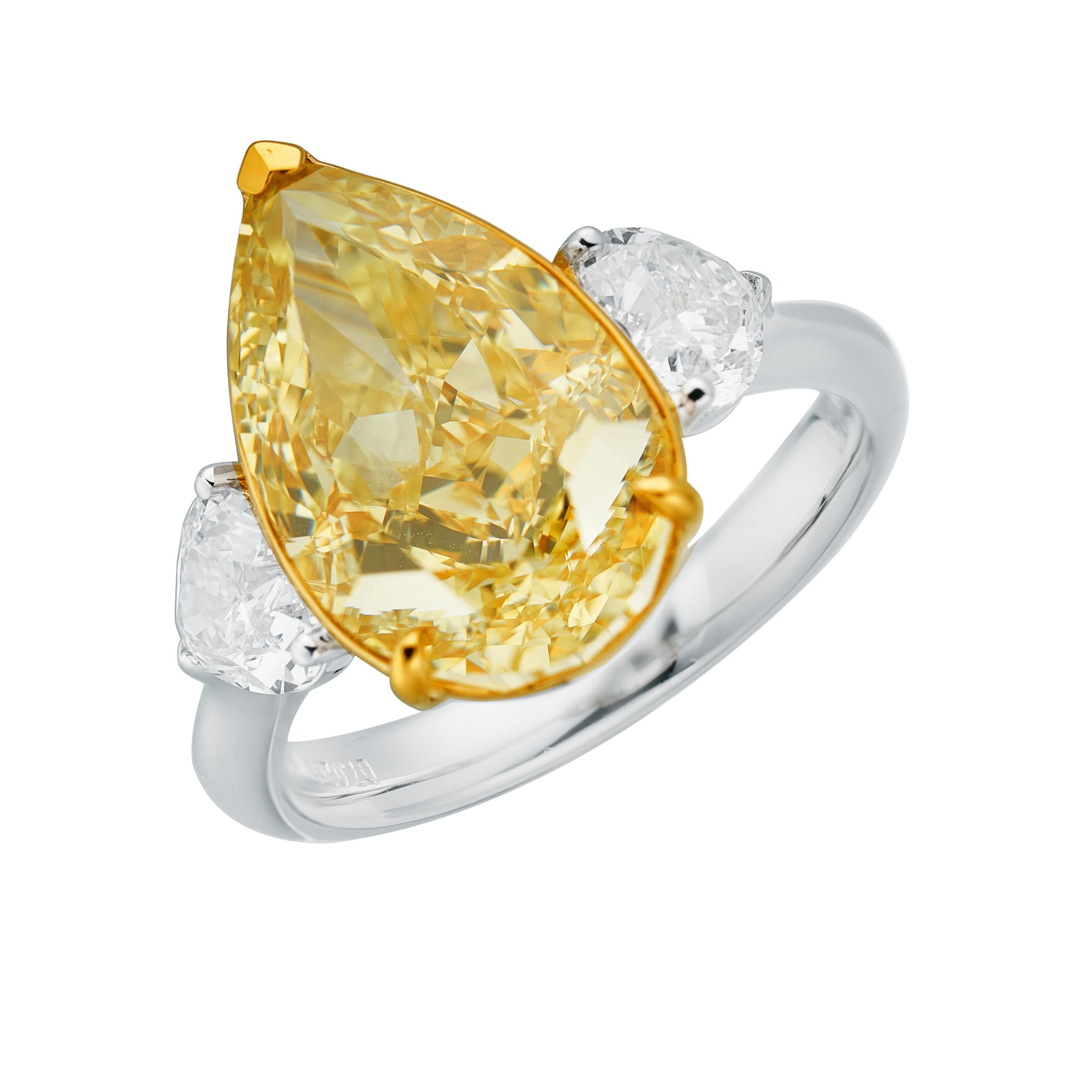 Contemporary GIA Certified, 7.02ct Natural Fancy Yellow Pear Shape Diamond Ring in 18KT  For Sale