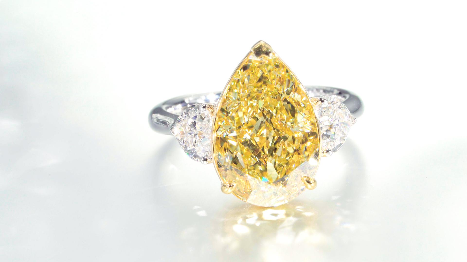 GIA Certified, 7.02ct Natural Fancy Yellow Pear Shape Diamond Ring in 18KT  For Sale 1