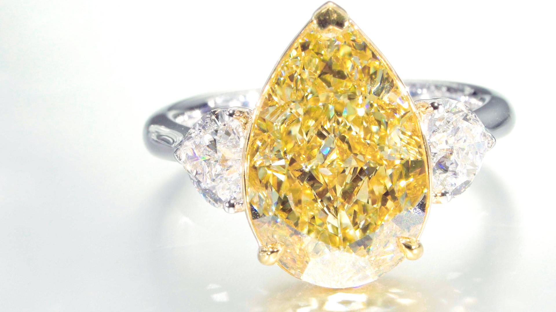 GIA Certified, 7.02ct Natural Fancy Yellow Pear Shape Diamond Ring in 18KT  For Sale 2