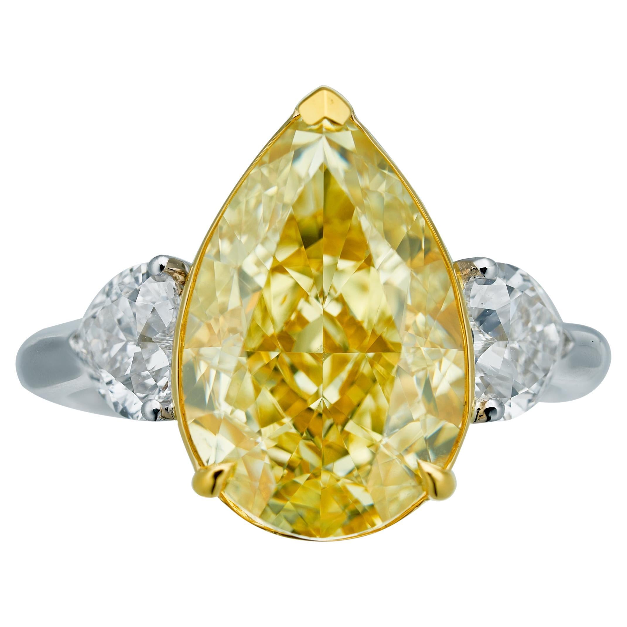 GIA Certified, 7.02ct Natural Fancy Yellow Pear Shape Diamond Ring in 18KT  For Sale