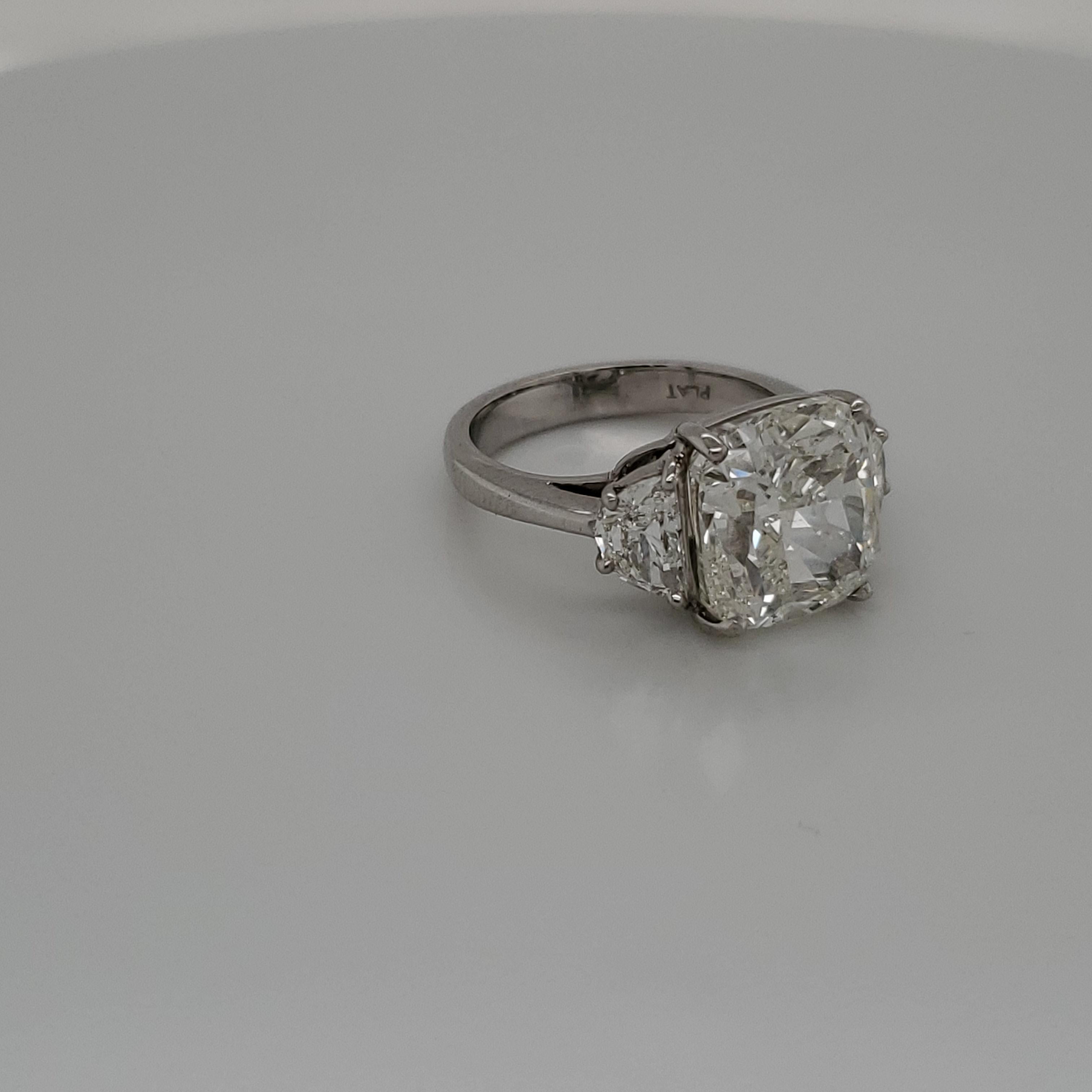 GIA Certified 7.03 Carat Cushion Cut Diamond J SI2 Three-Stone Ring In New Condition In New York, NY