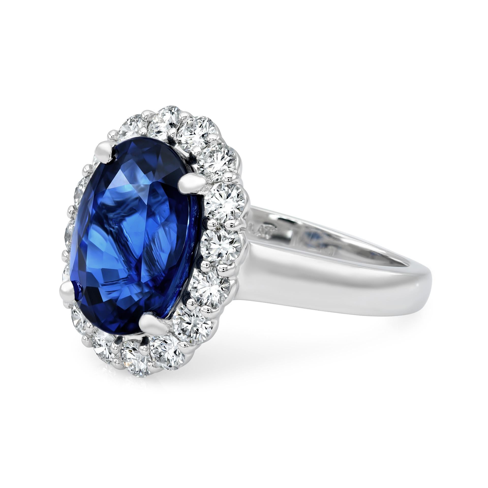 Experience the embodiment of elegance with our exquisite Blue Sapphire Ring. It features a stunning 7.03 carat natural blue sapphire from Sri Lanka, delicately set in a Platinum band adorned with 1.05 carats of dazzling diamonds. The oval-cut