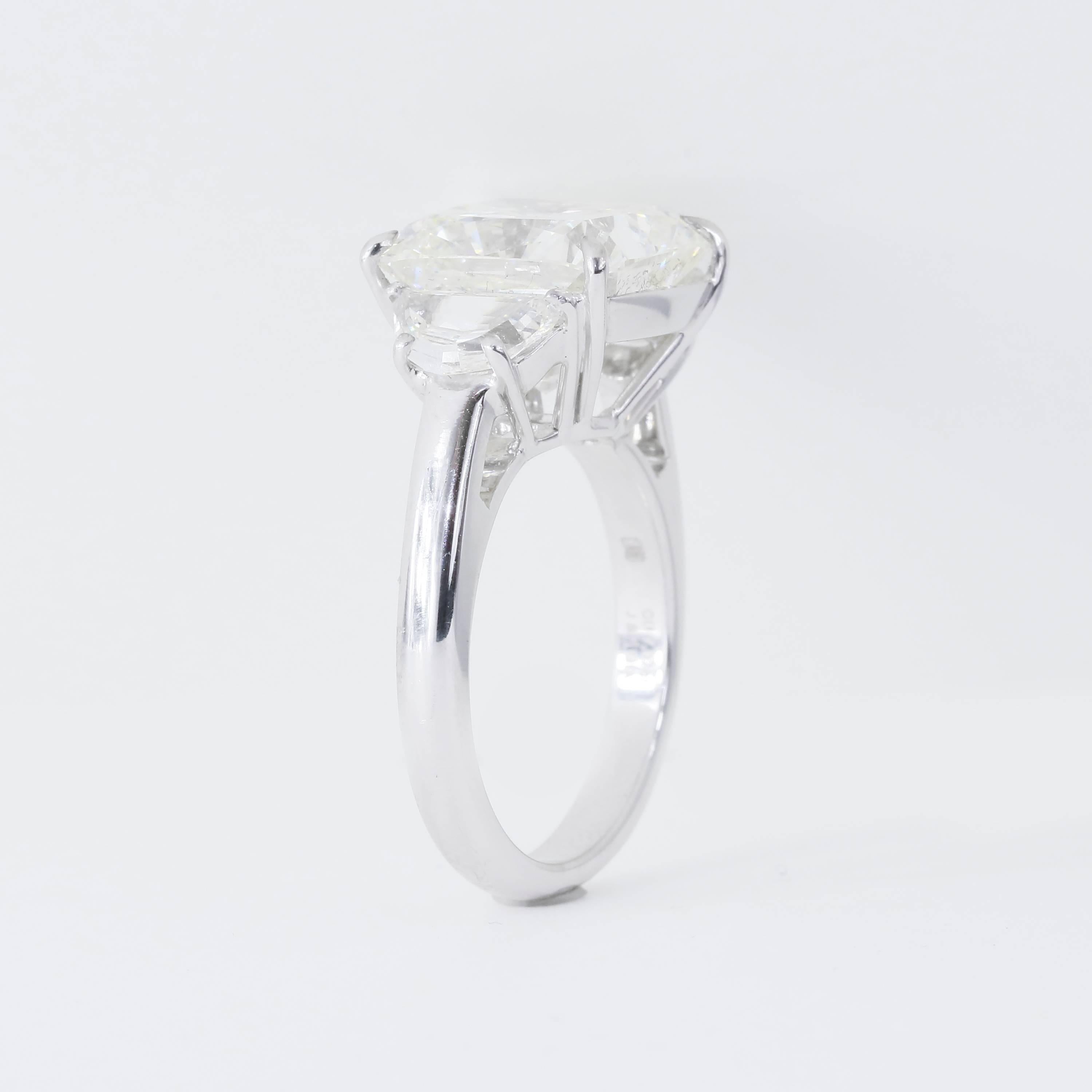GIA Certified 7.07 Carat J SI1 Cushion Diamond Three-Stone Ring with Half Moons In New Condition In Chicago, IL