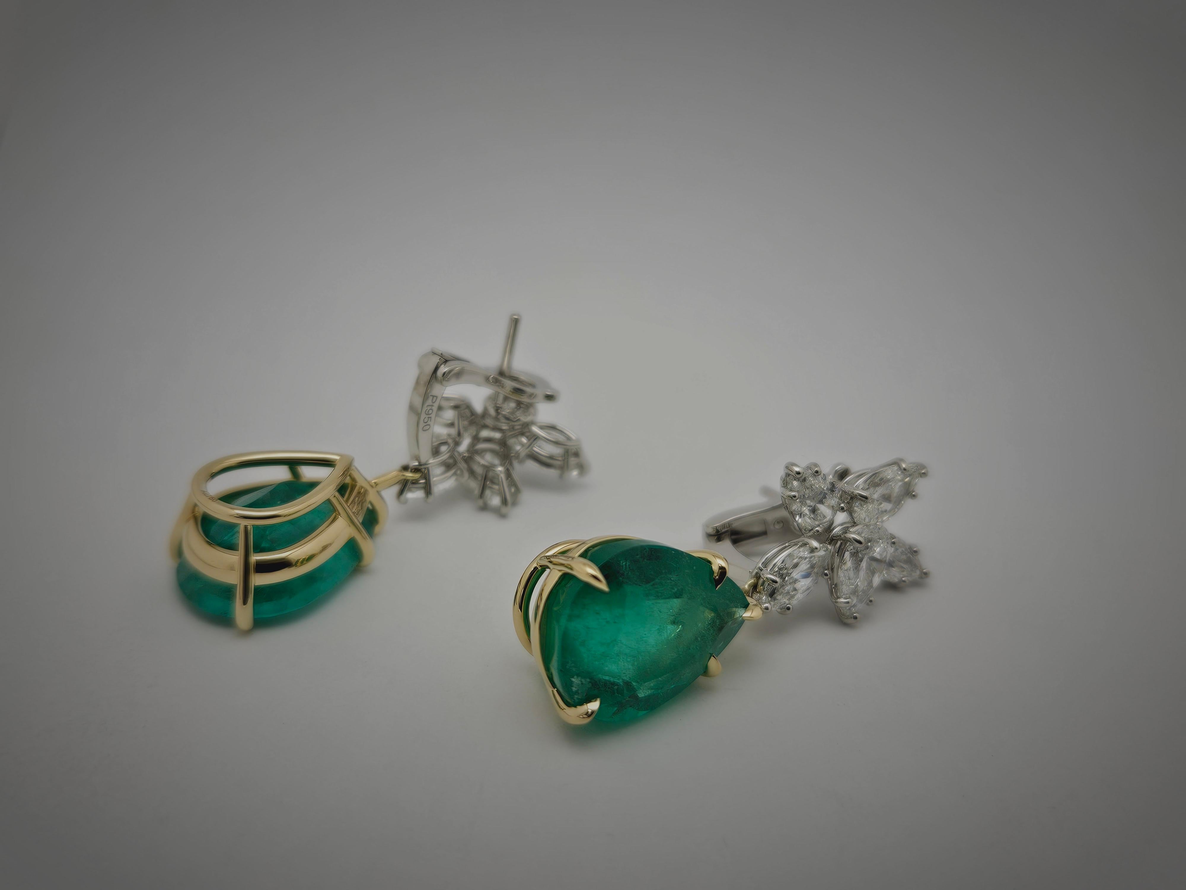 Découvrez l'élégance avec ces boucles d'oreilles en grappe d'émeraudes de Colombie, composées d'émeraudes de Colombie naturelles en forme de poire, certifiées par la GIA, de 5,86 CT et 7,08 CT, d'une clarté F1. Les émeraudes, connues pour leur riche