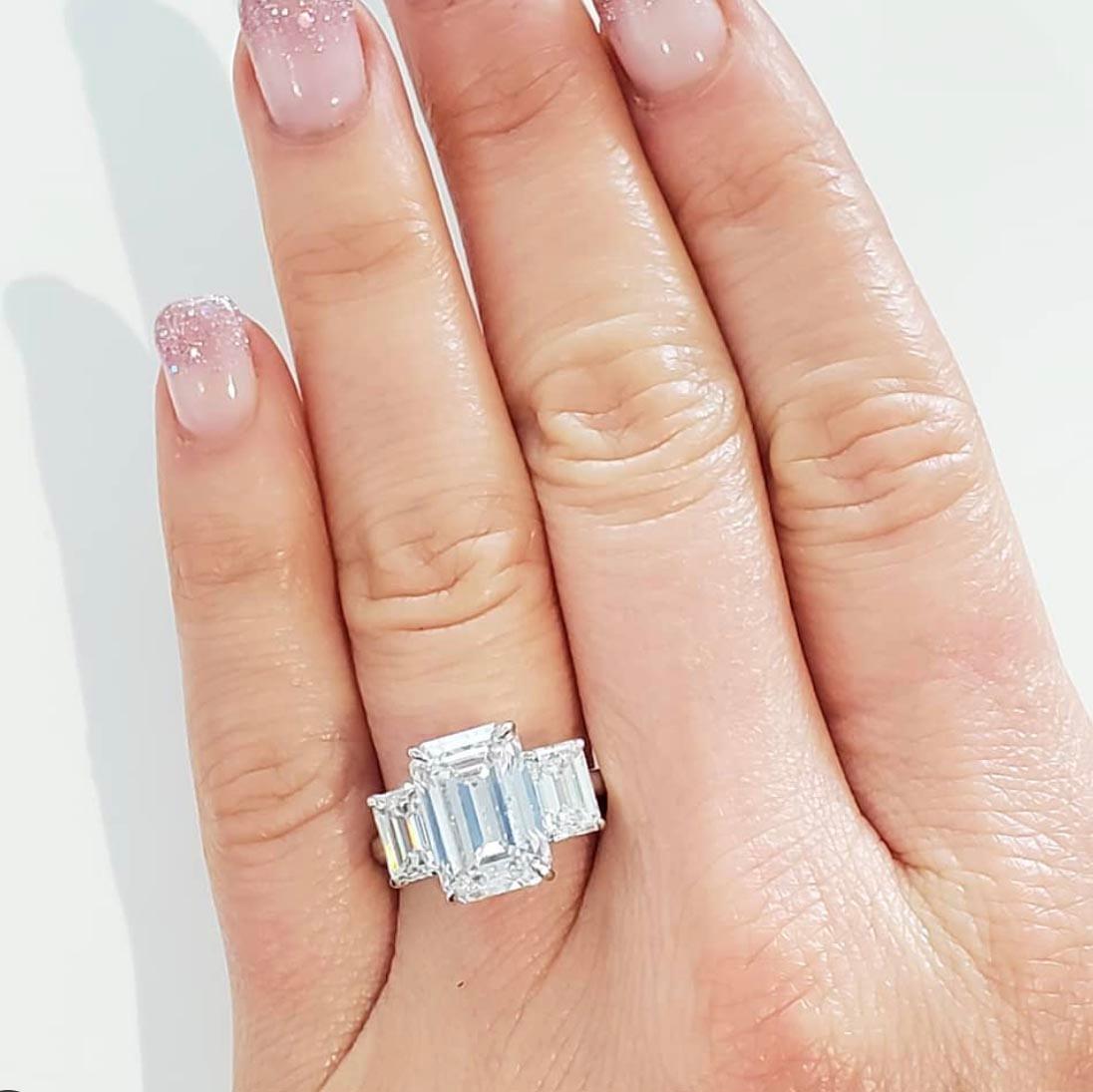 GIA Certified, 7.14 Carat Three-Stone Emerald Cut Diamond Ring In New Condition In Beverly Hills, CA