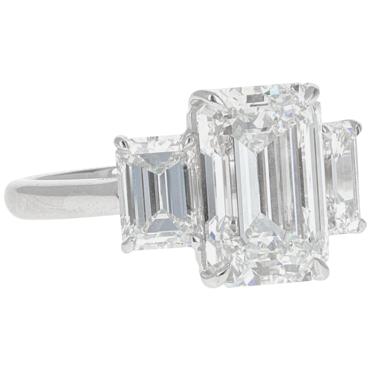 GIA Certified, 7.14 Carat Three-Stone Emerald Cut Diamond Ring