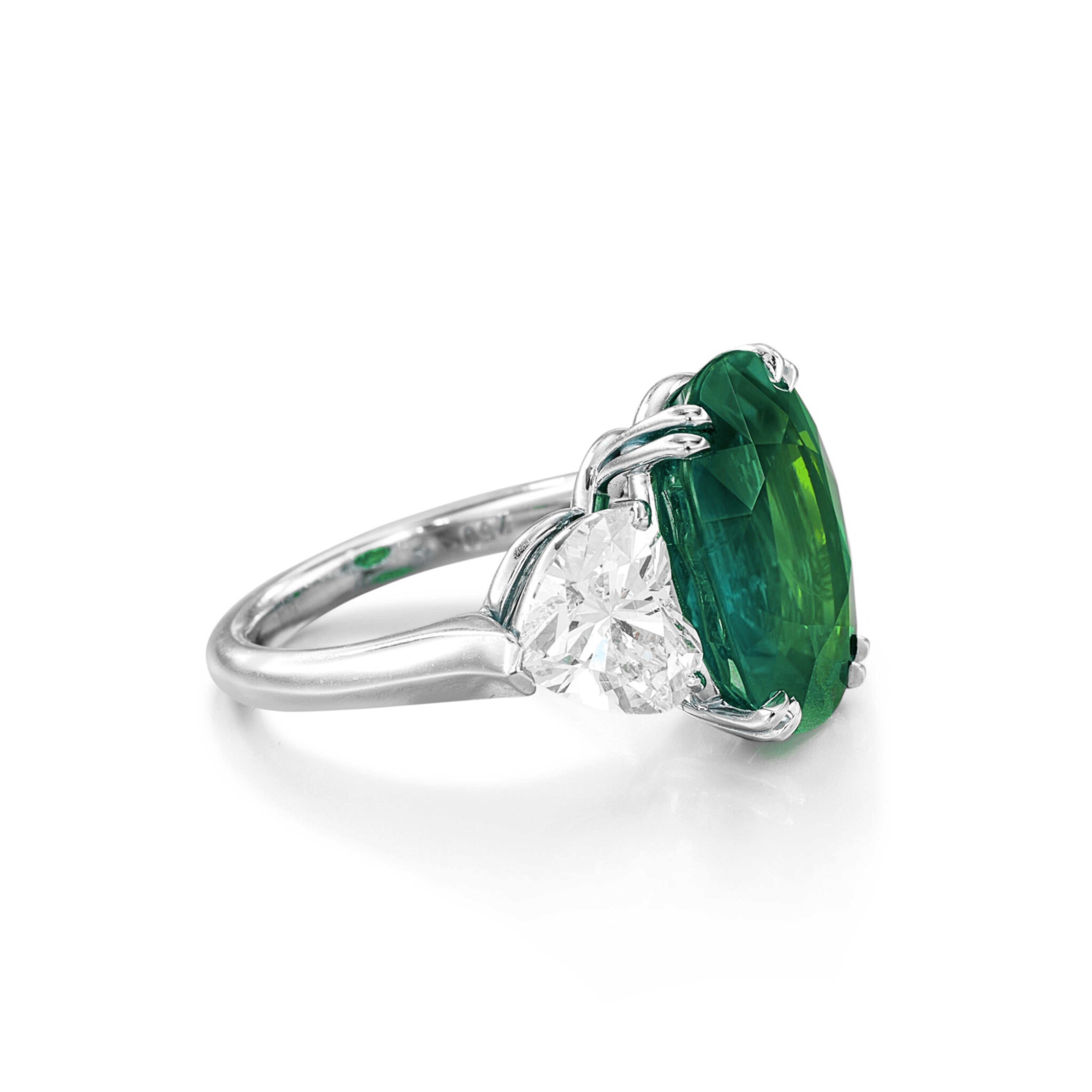 GIA Certified 7.26 Carat Green Colombian Emerald Heart Cut Diamond Ring, a true embodiment of elegance and luxury. This stunning piece features a heart-shaped emerald, renowned for its deep green hue and exceptional clarity, characteristic of the