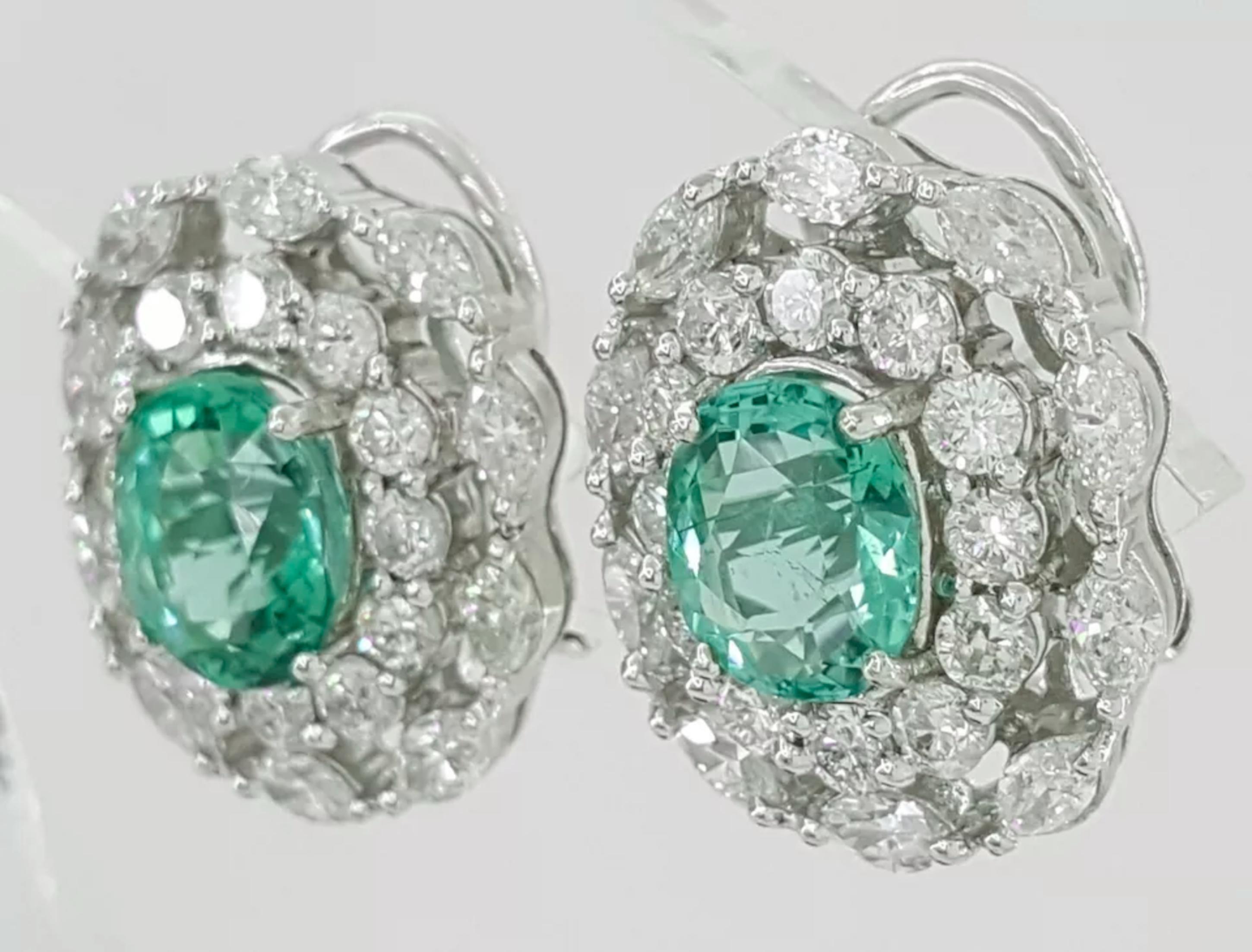 7.38 ct Total Weight Oval Paraiba Tourmaline & Diamond Earrings in 18K White Gold - GIA Certified

Elevate your jewelry collection with these exquisite GIA-certified earrings, showcasing the vibrant beauty of Paraiba tourmalines paired with