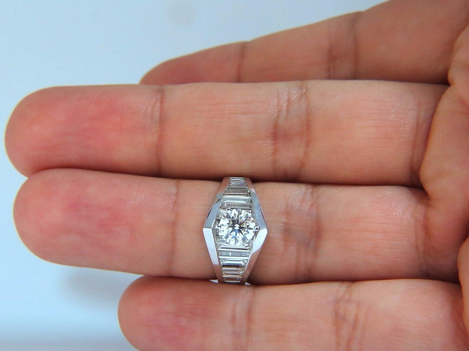 GIA .73ct. Round, brilliant diamond ring

Report: 2165625821

(please see certificate scan in photo menu)

F-color, vvs-1 clarity.

Excellent Cut

Excellent Polish

 Excellent Symmetry



Side diamonds:

1.50ct. Baguette, full cut

G-color Vs-1 &