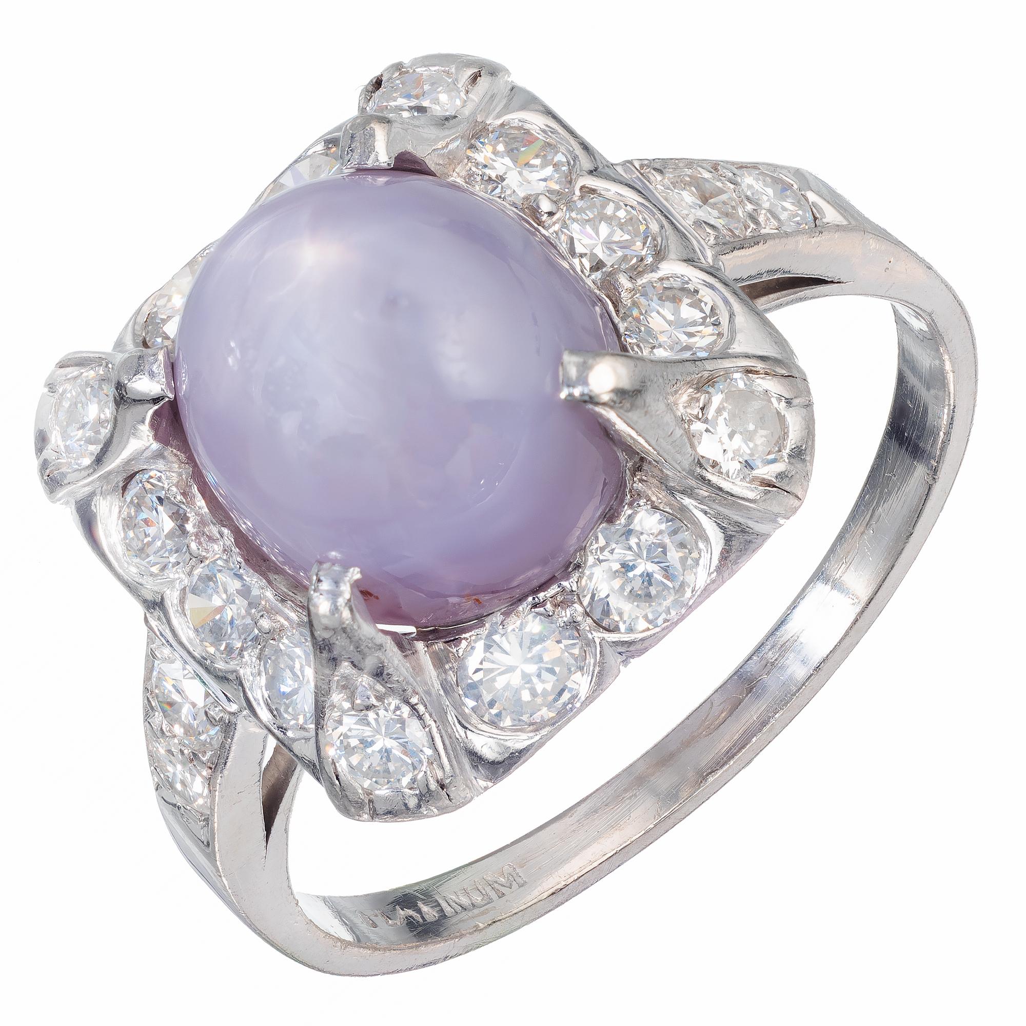 GIA Certified light violet translucent star sapphire and diamond engagement ring. circa 1940. Set in platinum with a round diamond halo.

1 oval natural light violet display asterism star sapphire, Approximate 7.40cts GIA Certified 2195777357
18