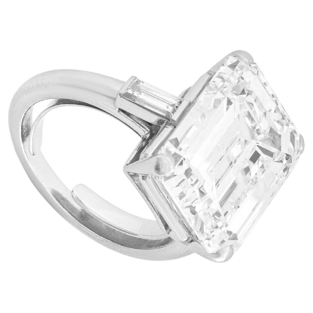 This elegant Cecile Blake design features a stunning GIA Certified 8 Carat Emerald Cut Diamond Engagement Ring, showcasing exceptional quality and design. This striking ring features a Type 2A diamond, known for its remarkable clarity and color,