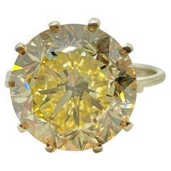 Retro GIA Certified 7.41 Carat Fancy Intense Yellow Diamond Solitaire Ring