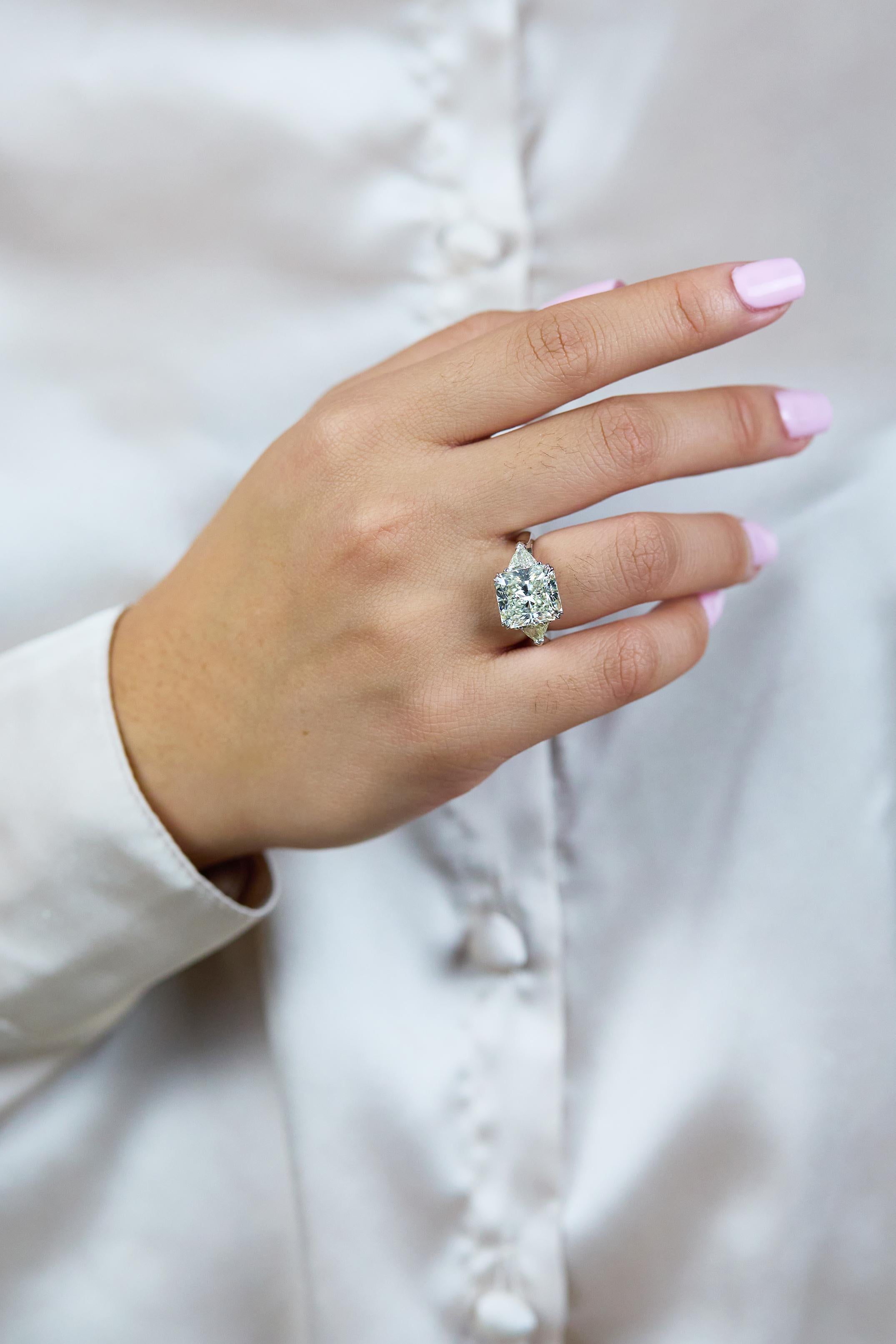 radiant cut diamond with trillion side stones