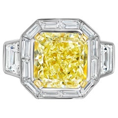 GIA Certified 7.43 Carat Yellow Diamond and Baguette Halo Ring