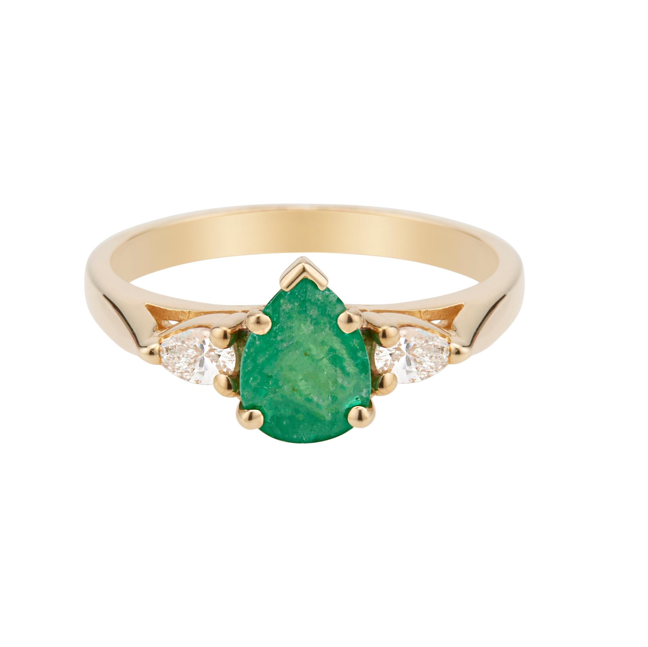 1960's Emerald and diamond engagement ring. GIA certified pear shaped emerald center stone in a 14k yellow gold three-stone setting with 2 pear shaped side diamonds.  

1 pear shaped green Emerald, approx. total weight .75cts, I, 8.0 x 5.84 x
