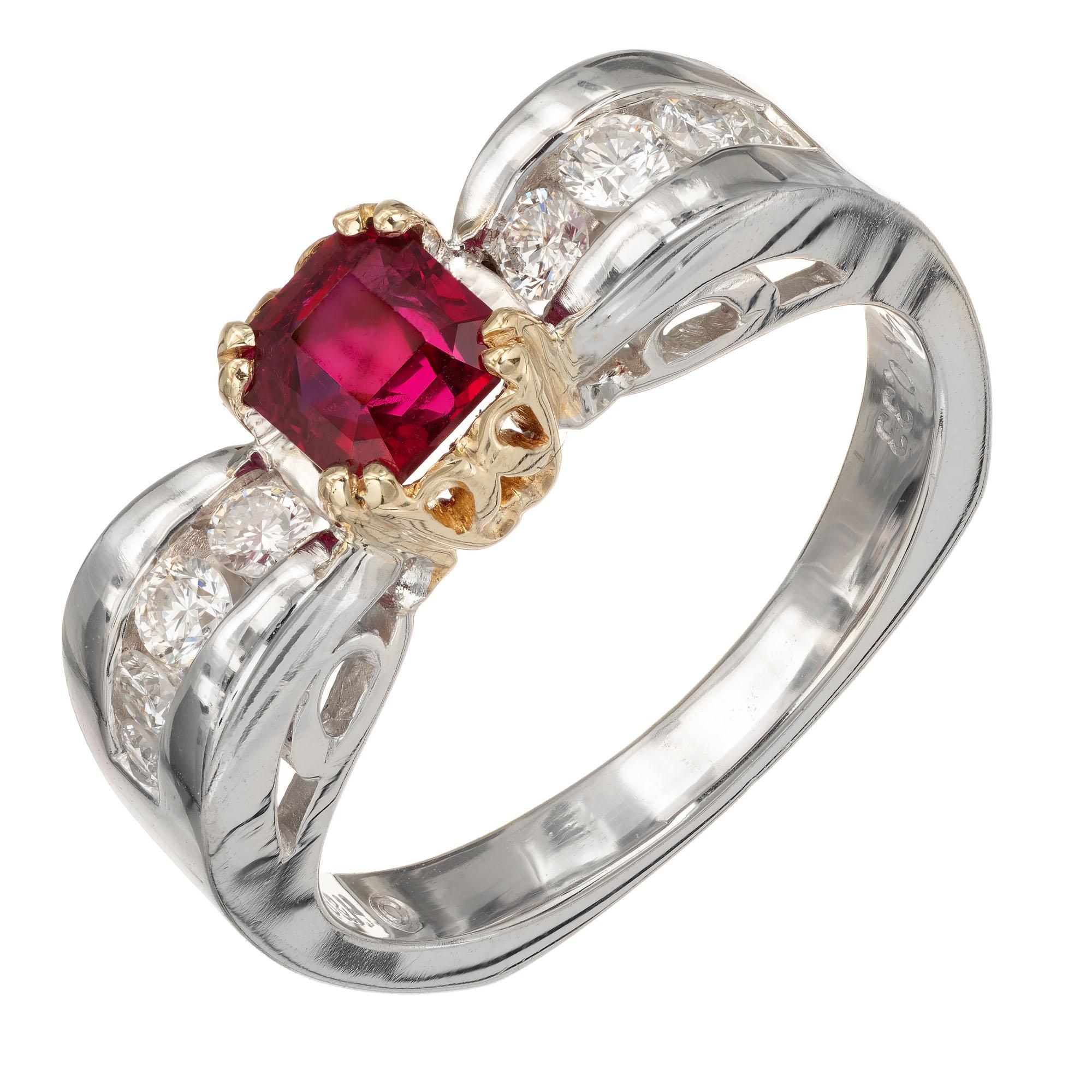 Octagonal red ruby and diamond engagement ring. Center ruby with 8 round accent diamonds along the shank, in a 14k white and yellow gold setting

1 octagonal step cut purplish red Ruby, approx. total weight .75cts, SI, 4.65 x 4.55 x 3.50mm, natural