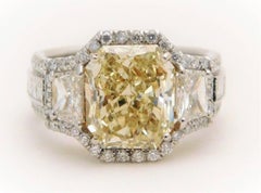 GIA Certified 7.57 Carat Handmade Radiant Cut Canary Yellow Diamond Ring