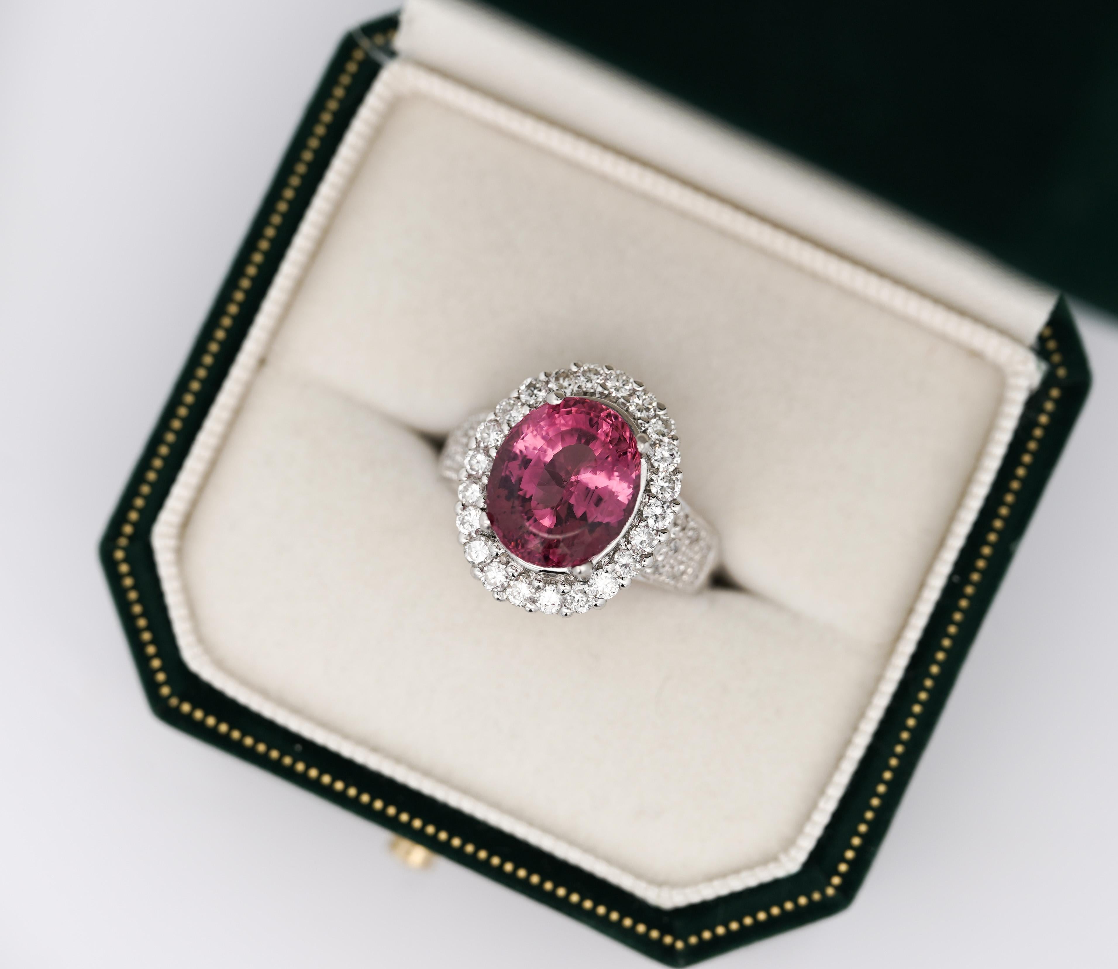 GIA Certified Oval Cut Pink No Heat Spinel and Diamond Ring in Platinum. 

GIA certified spinel center stone. Spinel has a pink hue and weighs 7.60 carats. The Spinel has non heat treatment and bears superb color, luster, and clarity. The center