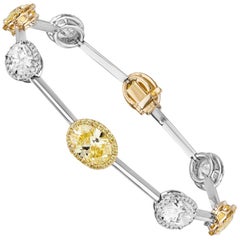 GIA Certified 7.61 Carat Fancy Yellow and White Oval Diamond Bracelet