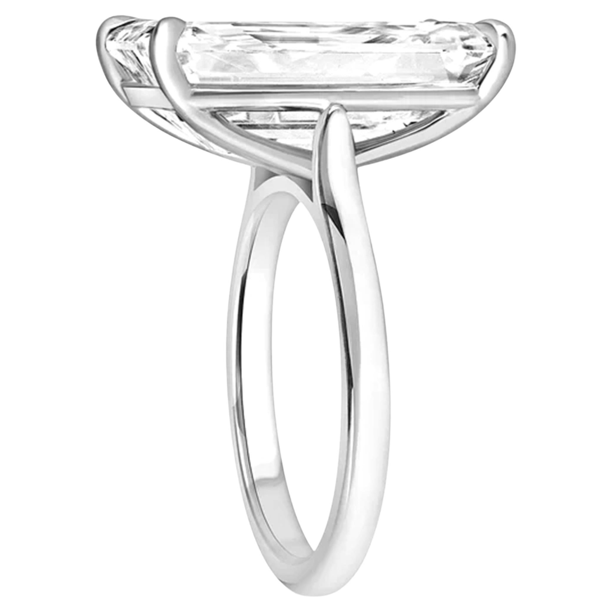 This breathtaking solitaire ring features a 7 carat emerald-cut diamond, GIA certified for its outstanding quality.

Crafted in 18K white gold, the sleek setting beautifully highlights the diamond's elegant shape. 
With an  Jcolor grade, the diamond