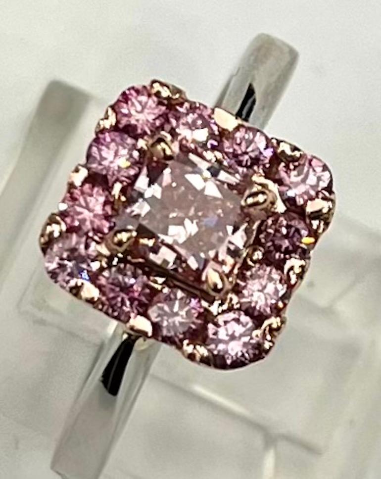 Contemporary GIA Certified .76Ct Radiant Diamond Natural Fancy Intense Purplish Pink Ring For Sale