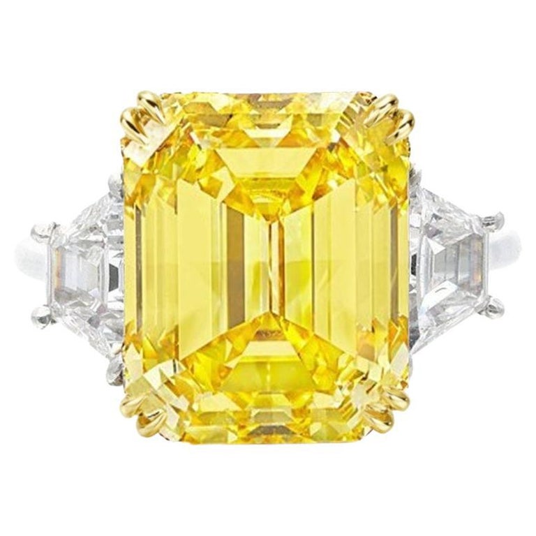 GIA Certified 7.70 Carat Emerald Cut Fancy Vivid Yellow Diamond Ring For Sale
