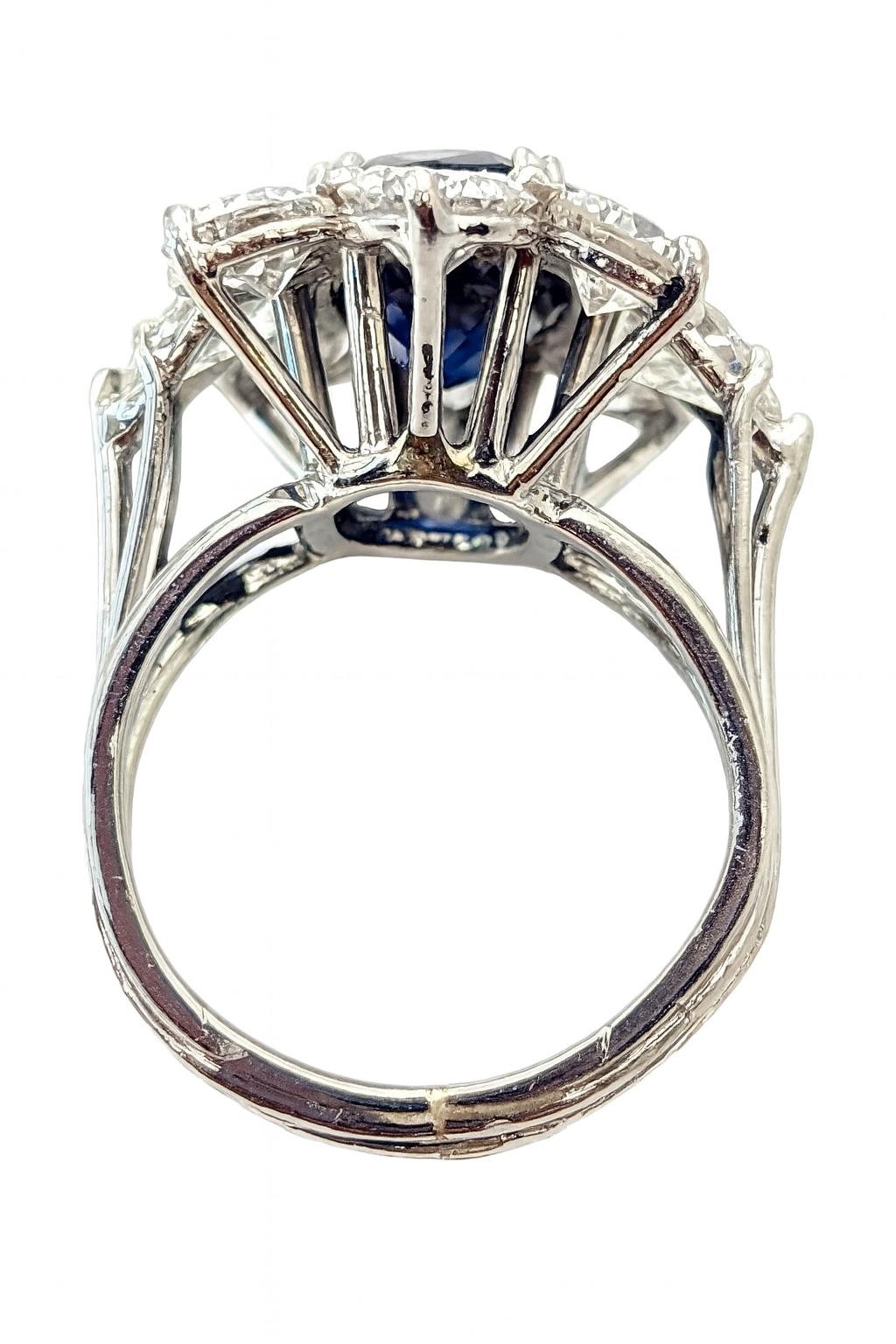 3.00 Carat Natural Sapphire and 4.70 Carat Diamond 14K Gold Ring

A striking cocktail ring featuring a vivid natural sapphire weighing approximately 3.00 carats. The sapphire, sourced from Thailand, displays a captivating transparent blue hue and is