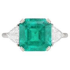 GIA Certified 7.72 Carat Colombian Emerald and Diamond Three-Stone Ring in 18K