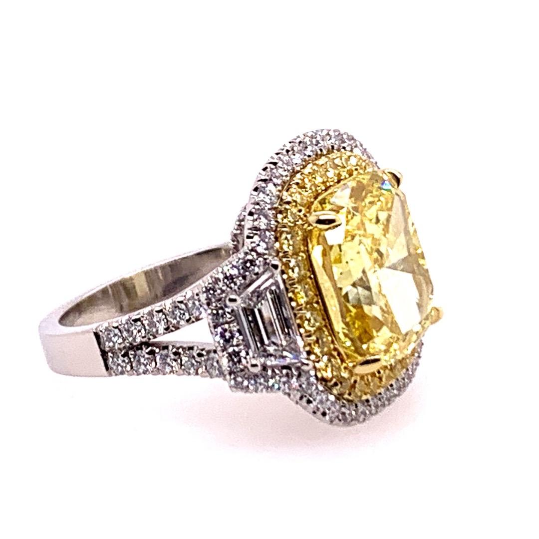 Women's GIA Certified 7.74 Carat Natural Fancy Vivid Yellow Diamond Modern Platinum Ring