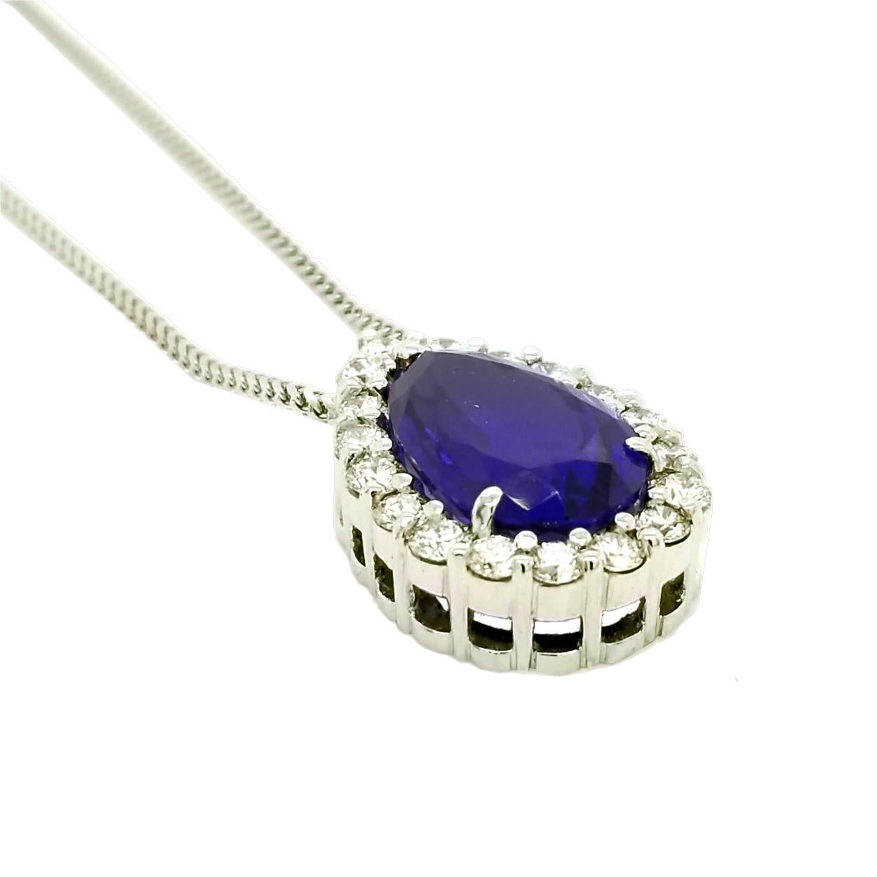 This Beautiful 18K Tear Drop Necklace with 18 2.6 mm Natural Round Diamonds total weight of 1.29 Ct (Shared Prong Set) hosts a magnificent color Tanzanite weighing 7.78 Ct.
Center Stone: 
GIA Certified 7.78 Ct Tanzanite
Dimension: 15.77x10.16x6.73