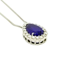 GIA Certified 7.78 Carat Pear Shaped Tanzanite Necklace with 1.29 Carat Diamonds