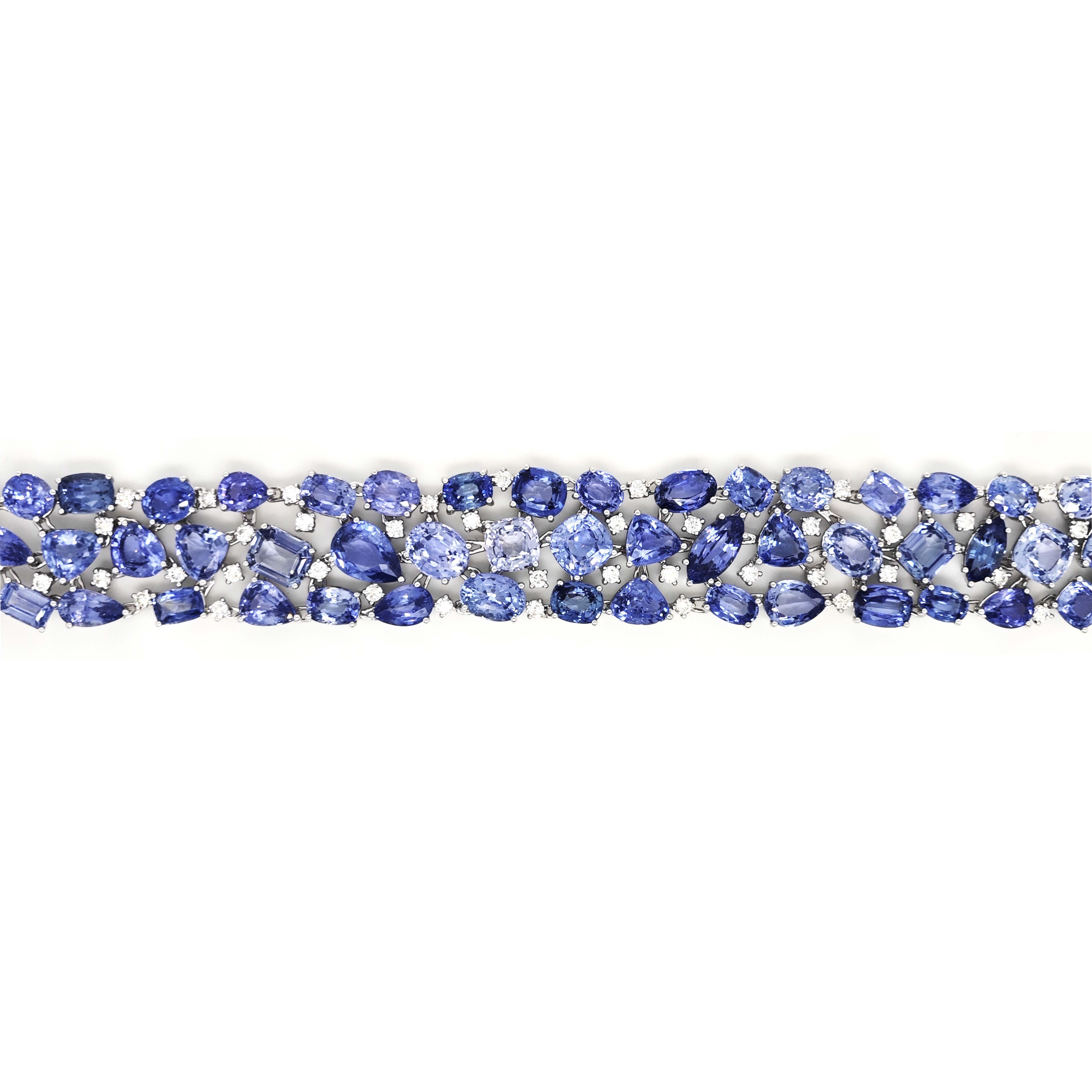 63 Sapphire Gemstone: 75.78 Carats
50 White Round Diamonds: 2.05 Carats
Metal: 18K White Gold, 31.50 Grams

GIA Certificate # 5234372421
