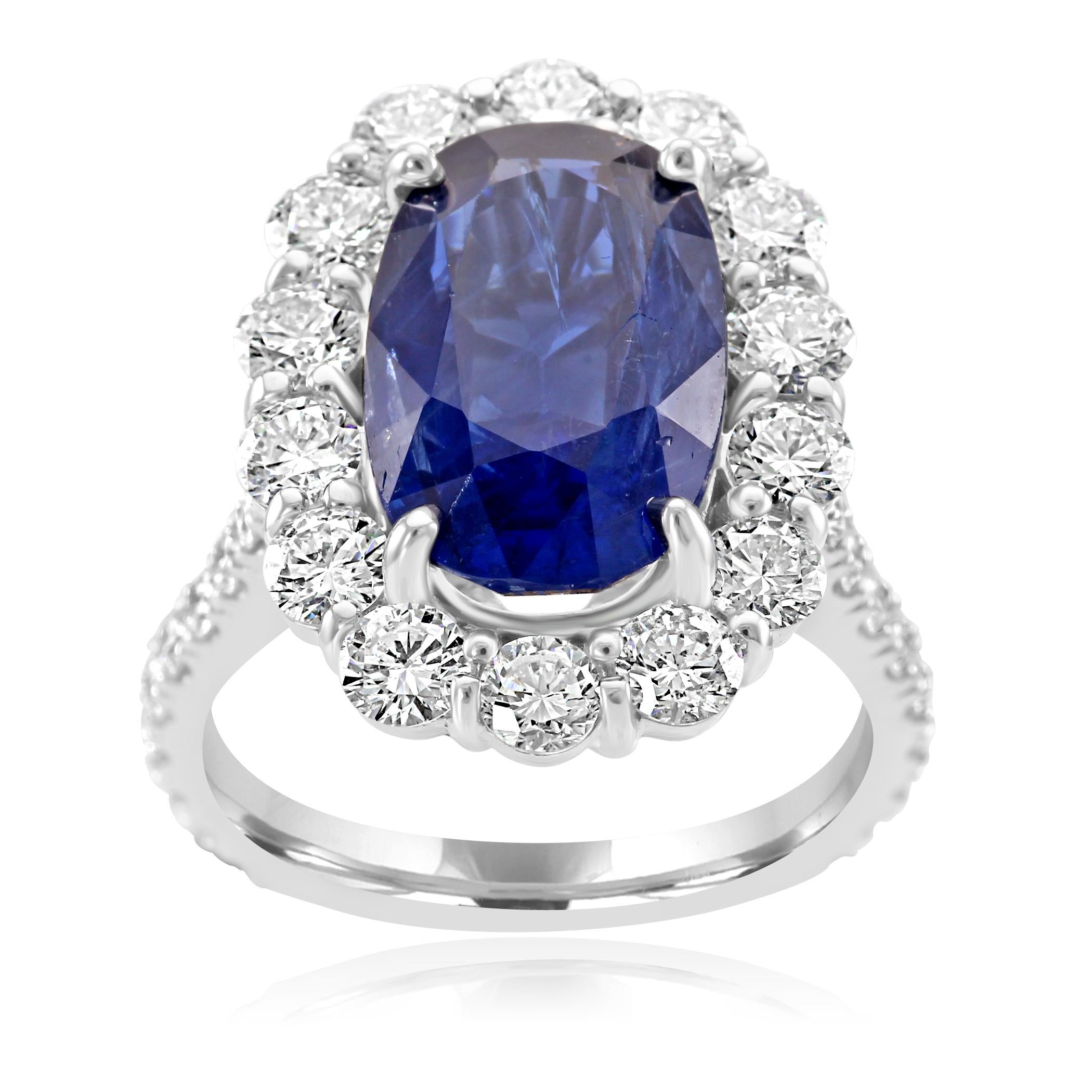 For the collector, rare 7.85 carat gem oval Blue sapphire. The sapphire is accompanied by GIA report stating the country of origin as Burma and and that there is no indication of heat treatment. Center Sapphire is encircled in a single halo of white