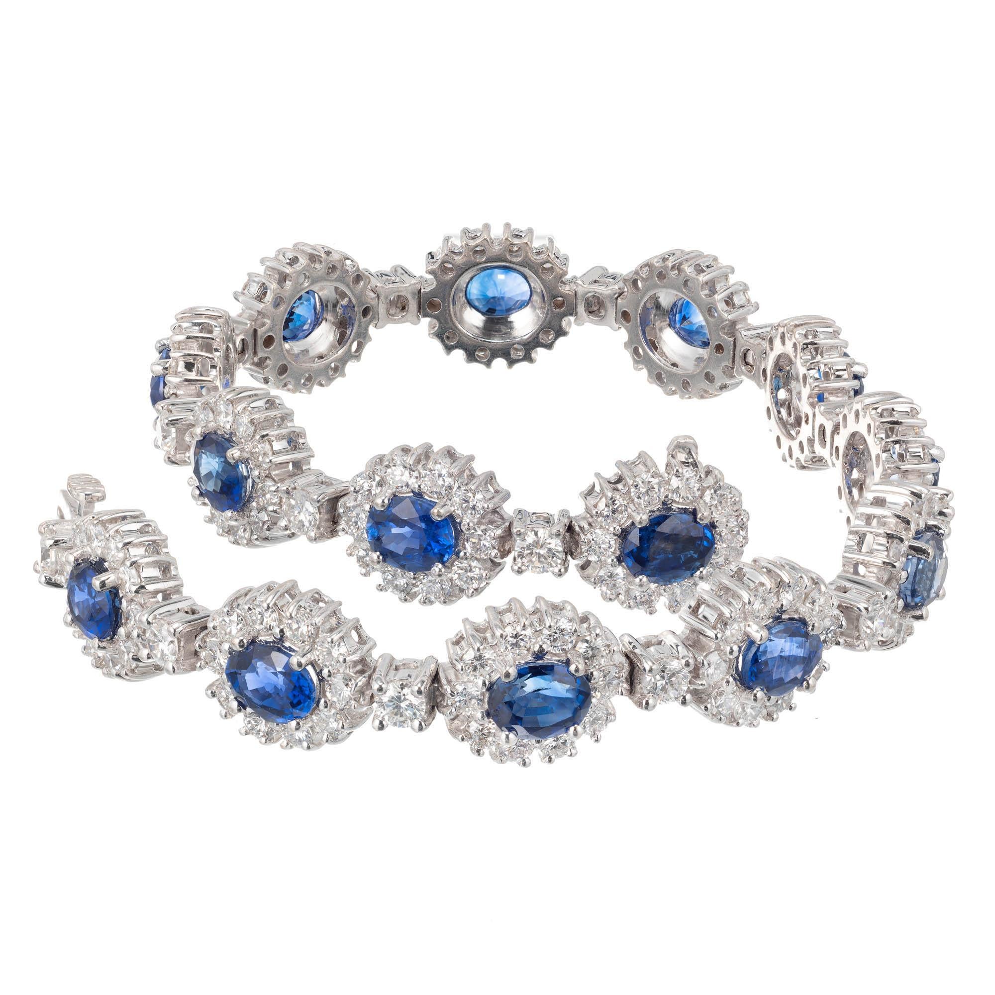 Vivid oval bright blue sapphire and Diamond halo bracelet with hidden built in catch and secure underside safety.

18k white gold
Tested and stamped: 18k
14 oval vivid blue Sapphires, approx. total weight 7.90cts, SI, GIA certificate # 2185148253 