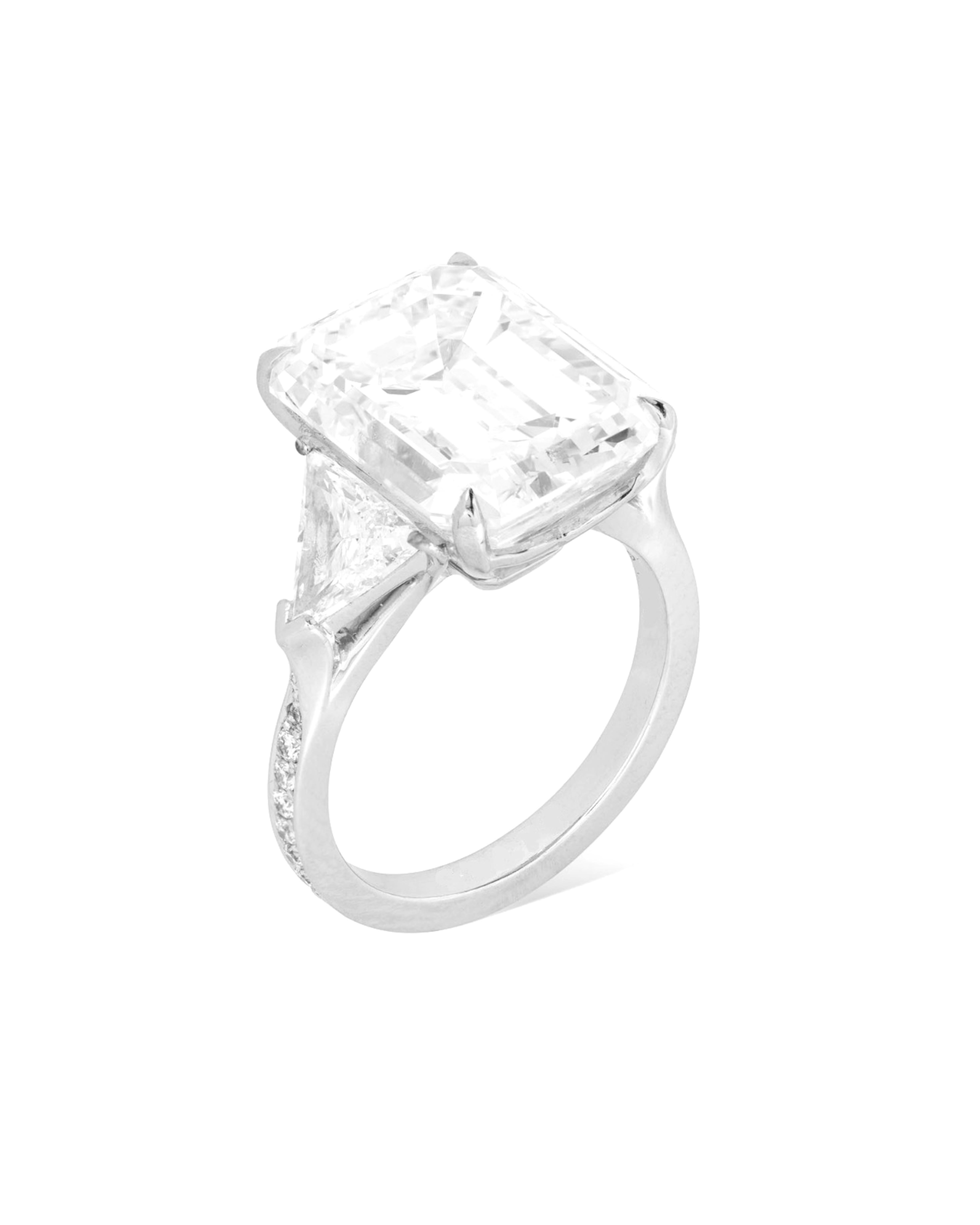 7.40 carat emerald cut diamond set in luxurious platinum, exuding elegance and sophistication. The central diamond is GIA certified, ensuring its quality and authenticity, with a Type IIA, E color and FLAWLESS clarity that contribute to its