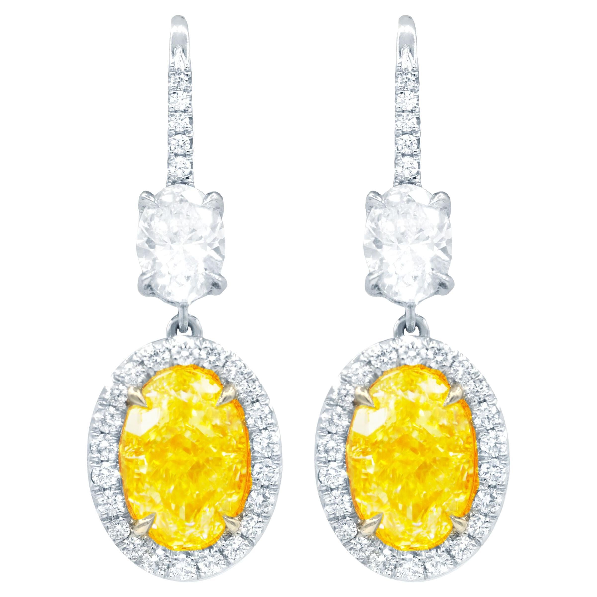 Diana M. GIA Certified 8 Carat Oval Shaped Yellow Diamond Earrings