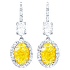 GIA Certified 8 Carat Oval Shaped Yellow Diamond Earrings